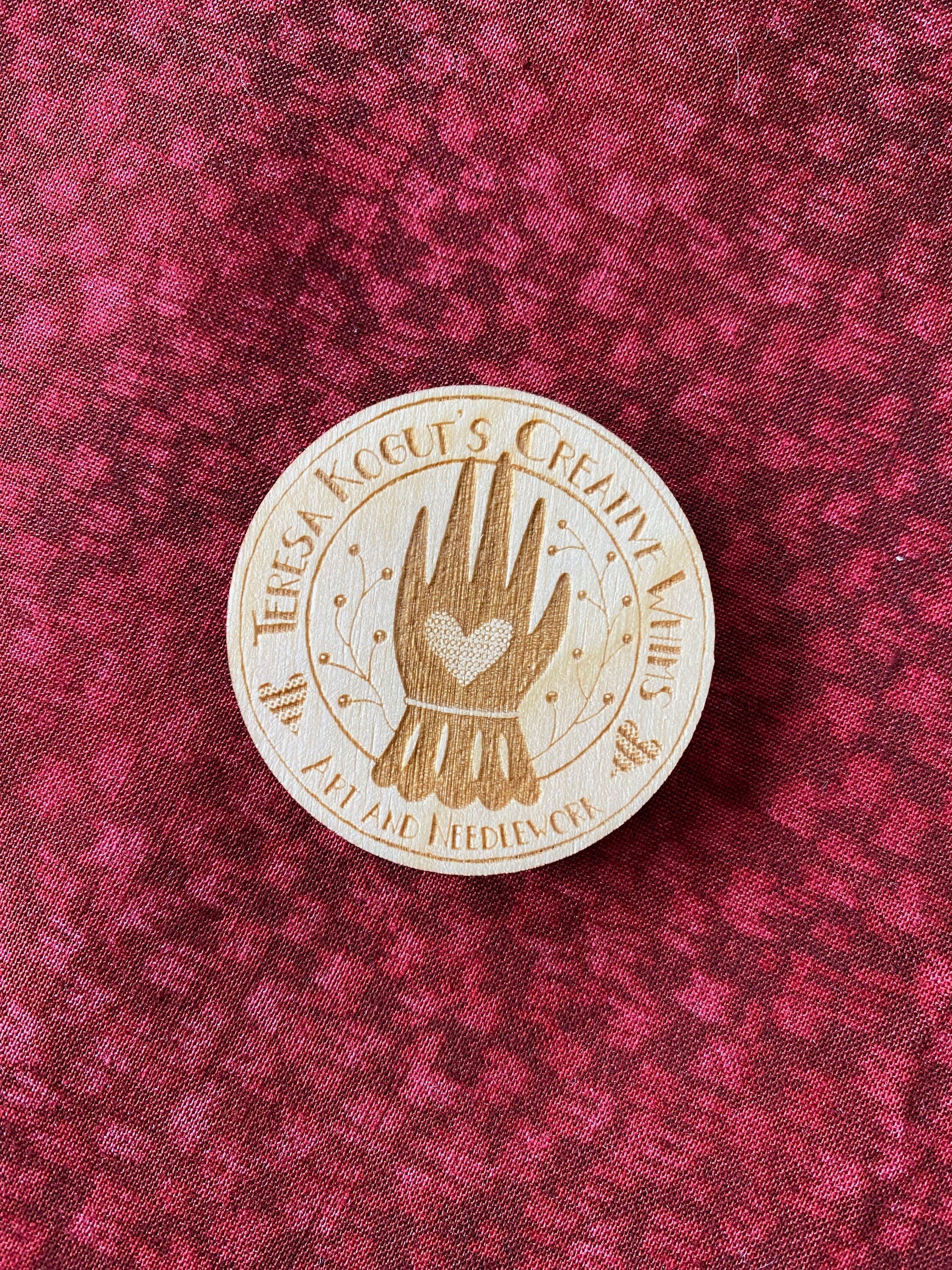 Needle Minder featuring Creative Whims logo